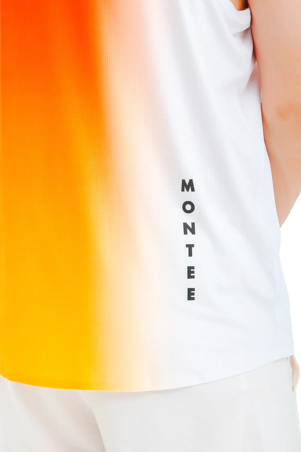 Close-up of the vertical MONTEE print on the Ember Fade mesh fabric